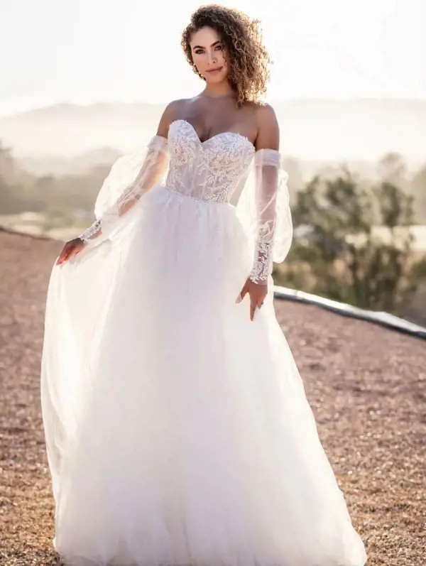 Model wearing a white Allure Bridals gown