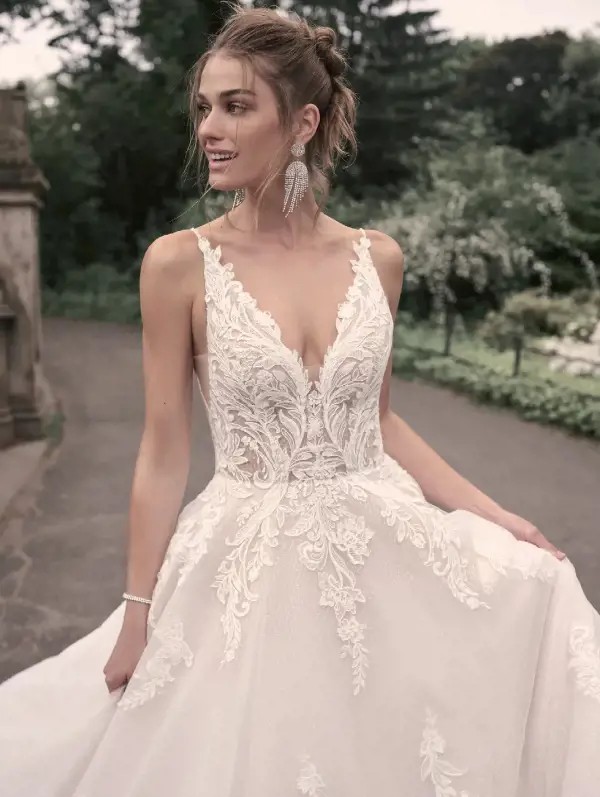 Model wearing a white Maggie Sottero gown