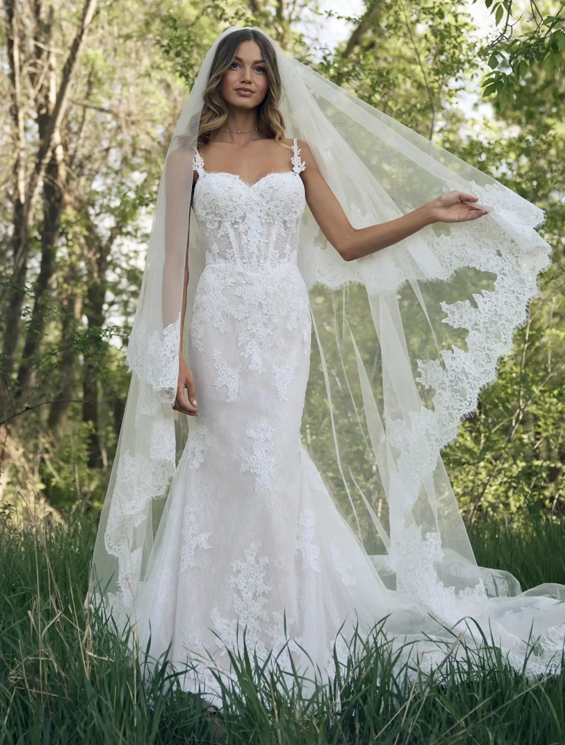 Model wearing a white Rebecca Ingram gown