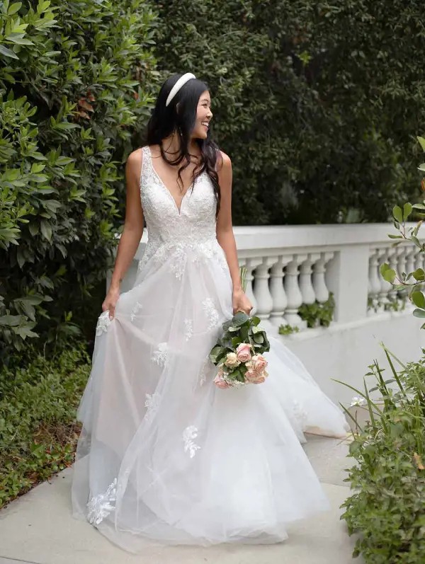 Model wearing a white Stella York gown